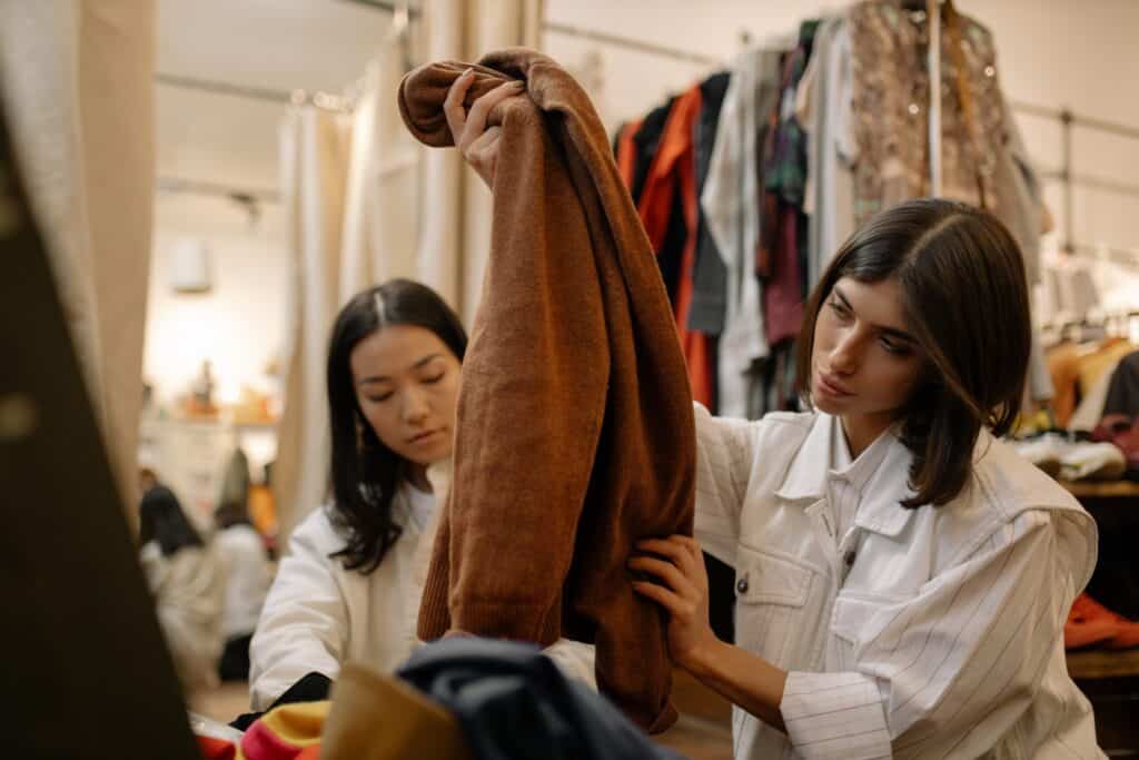 image showing people buying second-hand clothes